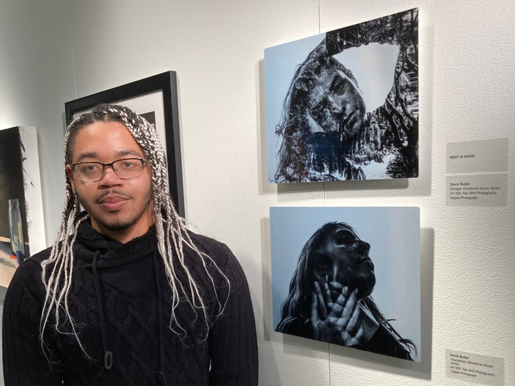 Devin Butler in front of his Best in Show Piece; Escape. . .